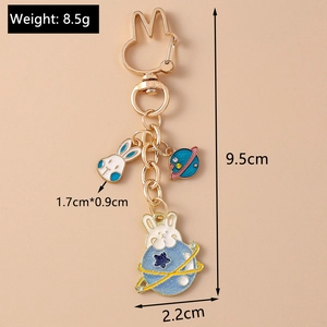 Vue détaillée du porte-clés lapin de l'espace avec dimensions et poids indiqués