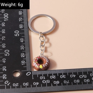 Detailed size measurement of realistic chocolate donut keychain with colorful sprinkles