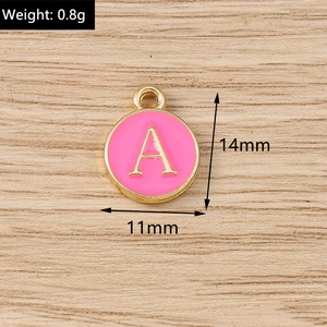Detailed view of pink enamel letter A charm with gold trim showing 11x14mm dimensions