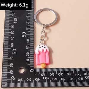 Detail view of pink popsicle keychain with ruler showing 3.5cm size and 6.1g weight