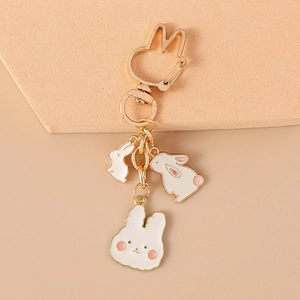 Détails de porte-clés lapin en métal avec pendentifs en émail blanc et rose mignon