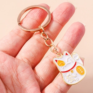 Fortune cat keychain in gold and white enamel with bell for wealth luck and bag decor