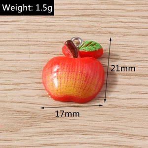 Macro shot of red apple resin pendant with dimensions 21mm by 17mm and weight 1.5g