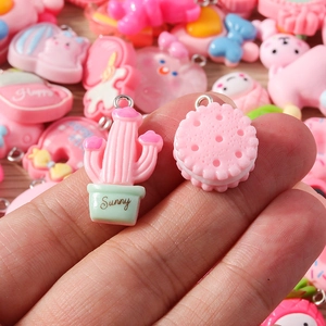 Detailed view of colorful resin cartoon pendants with metal loops for DIY jewelry making