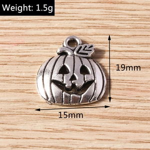 Macro detail of pumpkin charm showing 19x15mm dimensions and silver alloy texture