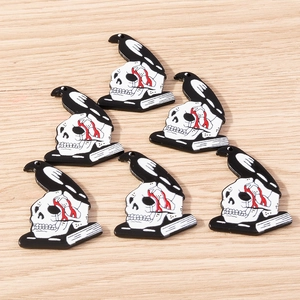 Detailed view of 6pcs gothic acrylic charms with white skulls, black ravens and red blood