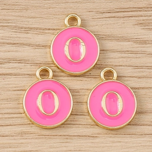 Detailed macro of pink enamel round alphabet O charms for DIY jewelry making