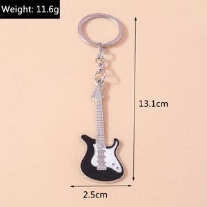 Detailed macro view showing a 13.1cm black and white guitar keychain with exact dimensions