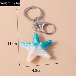 Detailed size specifications of starfish keychain showing 11cm height and 17.6g weight