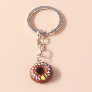 Detail of creative chocolate donut keychain with colorful sprinkles and silver ring clasp