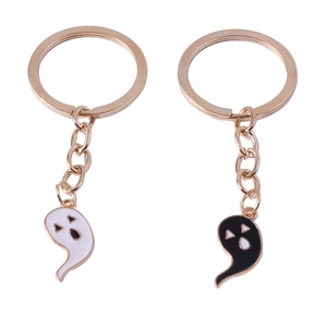 Cute cartoon ghost keychains in black and white with gold rings for Halloween backpack decor