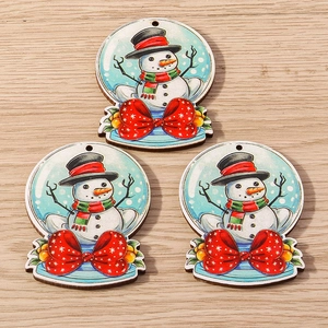 Three wooden Christmas snowman pendants with red bows and festive scarfs for DIY decor