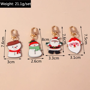 Vue détaillée de quatre porte-clés de Noël avec bonhomme de neige et Père Noël et dimensions