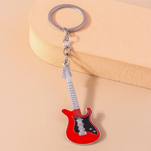 Detailed close-up of a red electric guitar keychain with a polished chrome keyring