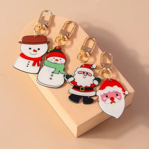 Lot de quatre porte-clés de Noël mignons avec motifs bonhomme de neige et Père Noël