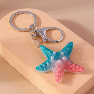 Detailed close-up of blue pink gradient starfish keychain with realistic resin texture