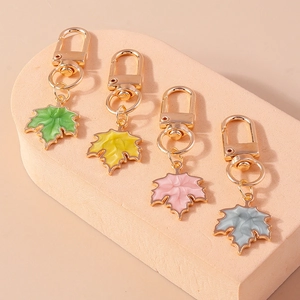 Exquisite maple leaf keychains in four colors with gold metal edges and lobster clasps