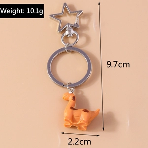 Detail view of orange dinosaur keychain showing 10.1g weight and 9.7cm total length dimensions