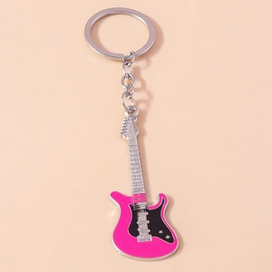 Close-up of guitar keychain with pink enamel finish and silver metal tuning details
