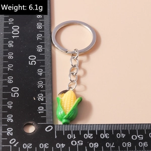 Realistic yellow corn keychain with green husks showing 6.1g weight and size details