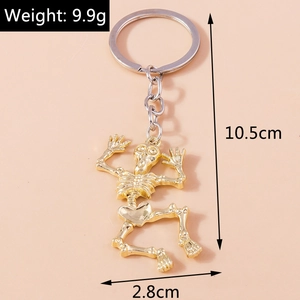 Golden skeleton keychain dimensions showing 10.5cm length and 9.9g weight details