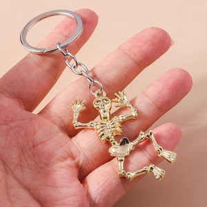 Cartoon skeleton keychain in polished gold metal for Halloween bag and backpack charms