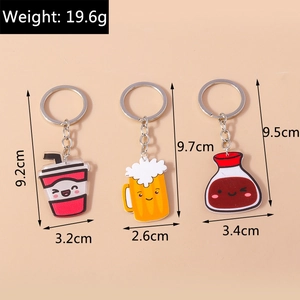 Detailed view of three cartoon acrylic drink keychains with silver chains and size labels