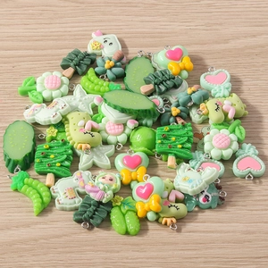 Mixed green resin charms with flower and heart shapes and metal hooks for DIY jewelry