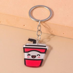 Close-up of creative cartoon beverage cup keychain with cute smiling face and silver ring