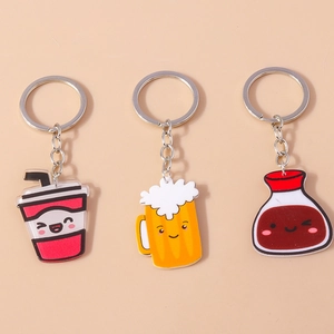 Set of three cartoon beverage keychains including milk tea and beer mugs with metal rings