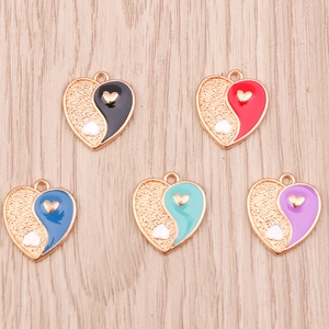 Assorted heart pendants with yin yang design in colorful enamel and gold finish