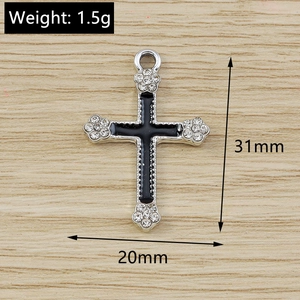 Gothic flower cross pendant with black enamel and rhinestones showing 31mm x 20mm size