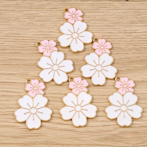 DIY cherry blossom charms with dual-color pink and white petals on gold metal base