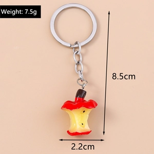 Detailed view of apple core keychain with 7.5g weight and 8.5cm length dimensions