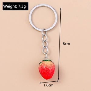 Detailed size view of strawberry keychain with weight and dimension specifications