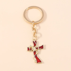 Gothic skull cross keychain with red enamel inlay and golden metal frame for backpack