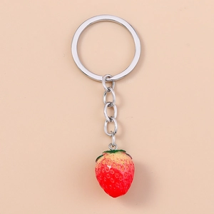 Realistic strawberry keychain with red gradient finish and silver metal ring for backpack