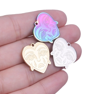DIY stainless steel heart pendants with face engraving in gold, silver, and iridescent