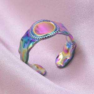 Detail of colorful iridescent ring featuring lava fluid texture and bead edge design
