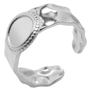 Detail of silver irregular lava texture adjustable open ring with a smooth circular face