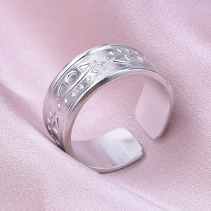 Detailed macro view of silver adjustable ring featuring embossed evil eye patterns