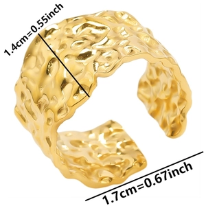 Detailed view of adjustable gold-tone textured ring with dimensions 1.4cm width and 1.7cm diameter