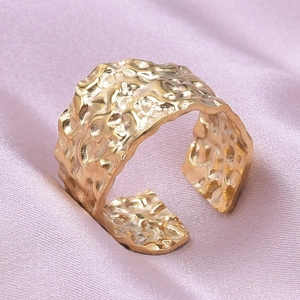 Macro shot of 304 stainless steel adjustable open ring with hammered texture detail