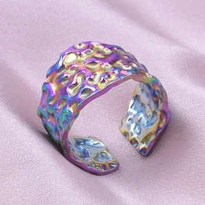 Detail of adjustable iridescent 304 stainless steel ring with unique lava texture