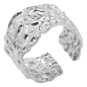 Detail view of the hammered texture on this wide adjustable stainless steel open ring