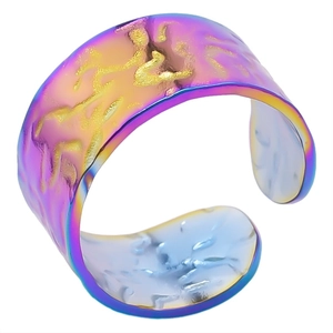 Macro detail of rainbow iridescent hammered texture on adjustable stainless steel ring