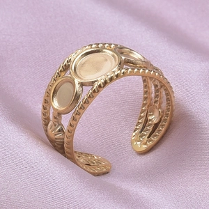 Detailed view of adjustable golden ring with three circular DIY bezel settings