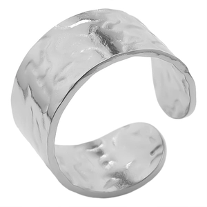 Detail showing the hammered texture and silver finish of the adjustable stainless steel ring