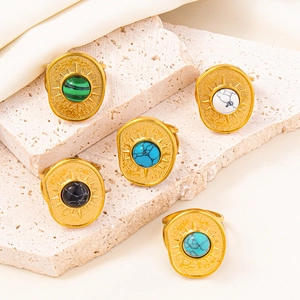 Set of 5 bohemian gold rings with colorful round stones and solar ray pattern textures