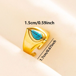 Detailed view of adjustable golden ring with blue teardrop stone and 1.5cm dimension